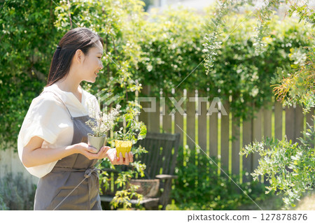 Women with plant seedlings 127878876