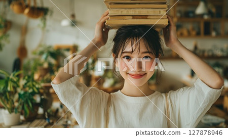 A woman with a book on her head A woman with a book on her head 127878946