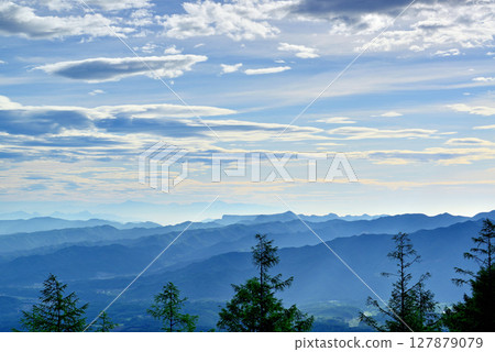 Fairy Tale Highway: A spectacular view of the Saku city and mountains in the morning mist from the pass 127879079
