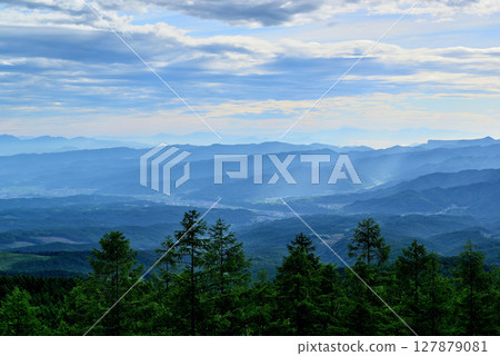 Fairy Tale Highway: A spectacular view of the Saku city and mountains in the morning mist from the pass Fairy Tale Highway: A spectacular view of the Saku city and mountains in the morning mist from the pass 127879081
