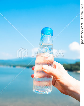 A cold bottle of Ramune in hand, film style 127879648