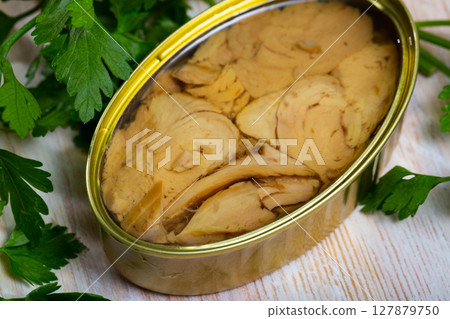 Open tin can of tuna in oil 127879750