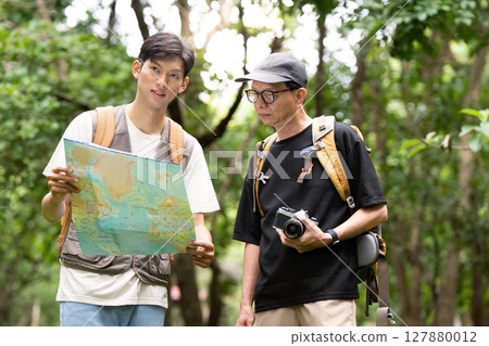 Hiking Adventure: Father and Son Exploring Nature with Map Hiking Adventure: Father and Son Exploring Nature with Map 127880012