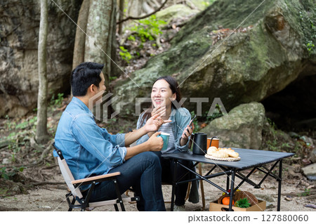 Couple Laughing and Sharing Moments at Camping Site 127880060