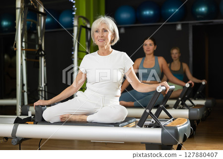 Portrait of a mature woman in a Pilates workout 127880407