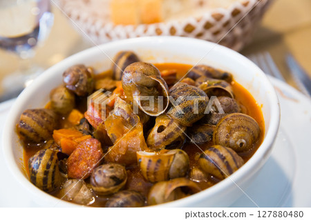 Homemade stewed escargots with chorizo Homemade stewed escargots with chorizo 127880480