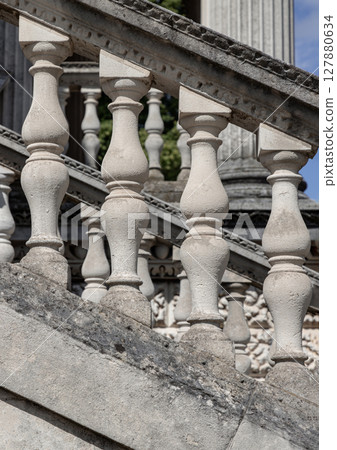 Several balusters classic constructed from stone, which are the vertical supports forming the railing of the grand staircase. 127880634