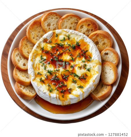 Delicious Baked Camembert with Honey Drizzle and Fresh Thyme Garnish Served with Crispy Bread Slices 127881452