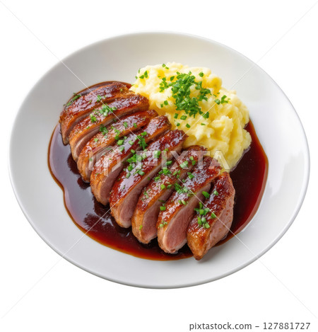 Seared Duck Breast Cooked to Perfect Medium Rare with Crispy Skin and Mashed Potatoes in Elegant Presentation 127881727