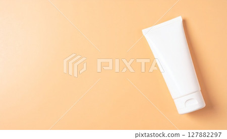 Simple sunscreen image on pale peach background 127882297