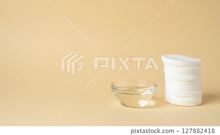 Toner and cotton material on a natural color background 127882418