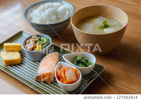 A classic Japanese breakfast set with grilled salmon, natto, rolled egg, and miso soup A classic Japanese breakfast set with grilled salmon, natto, rolled egg, and miso soup 127882614