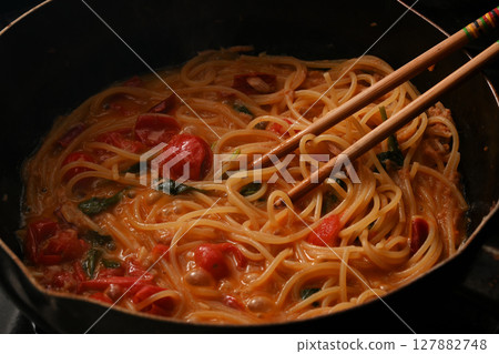 Tuna and cherry tomato pasta being cooked Tuna and cherry tomato pasta being cooked 127882748