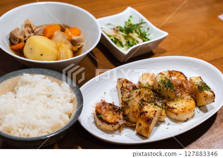 A Japanese-style dinner plate with roasted yam and meat and potatoes 127883346