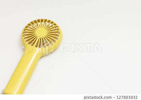 Yellow handy fan | White background Yellow handy fan | White background 127883832