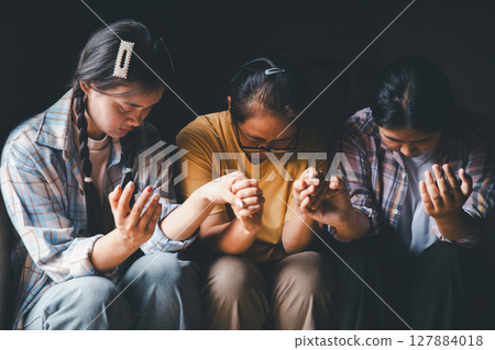 Close up group christians hands pray to God with spiritual faith on holy bible in catholic church. religion worship prayer ask god bless grace jesus believe. Christianity religion prayer holy worship 127884018