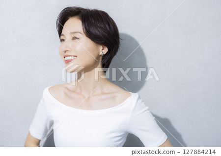 A woman with short hair A woman with short hair 127884214