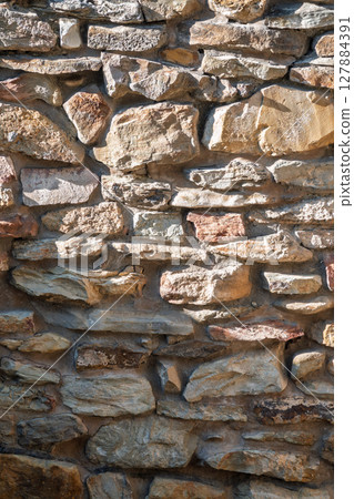 Backgrounds of the old stone wall. 127884391