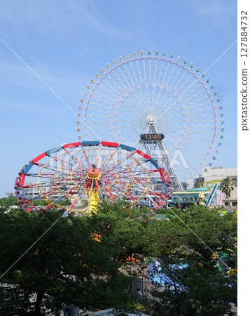 Amusement park ferris wheel and blue sky Amusement park ferris wheel and blue sky 127884732