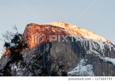 Half dome illuminated by the setting sun Half dome illuminated by the setting sun 127884745