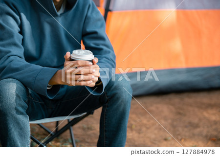 Business concept of cafe focuses on nurturing coffee in harmony with nature, organic seed create warm cup caffeine, background green fresh great outdoor. aromatic drink, rich aroma of rising from mug 127884978