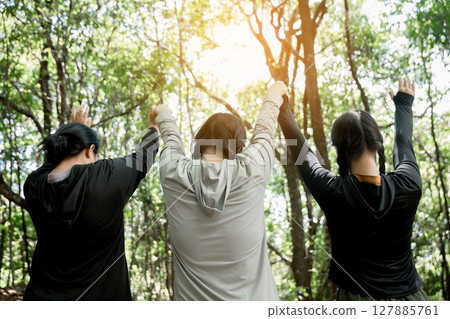 Grateful woman having HOPE praying to God. Spiritual girl smiling to sky. Happy female being thankful. Spiritual girl praying with hope. Positive Asian young woman feeling hope and faith looking up. 127885761