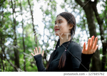 Grateful woman having HOPE praying to God. Spiritual girl smiling to sky. Happy female being thankful. Spiritual girl praying with hope. Positive asian young woman feeling hope and faith looking up. Grateful woman having HOPE praying to God. Spiritual girl smiling to sky. Happy female being thankful. Spiritual girl praying with hope. Positive asian young woman feeling hope and faith looking up. 127885762