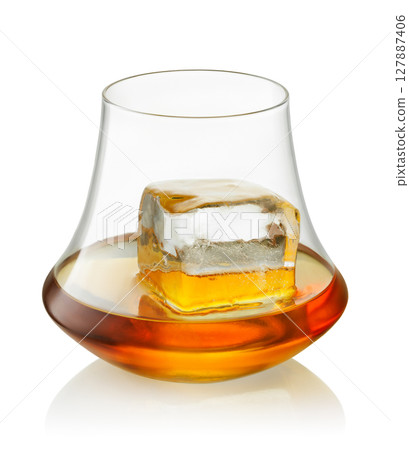 Glass scotch whiskey or rum and one big piece ice isolated on white background with clipping path Glass scotch whiskey or rum and one big piece ice isolated on white background with clipping path 127887406