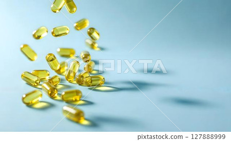Yellow pills tumble from the air, embodying the pharmacy concept and highlighting the significance of medications 127888999