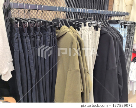 Modern clothing display showcasing casual styles in a trendy boutique Modern clothing display showcasing casual styles in a trendy boutique 127889071