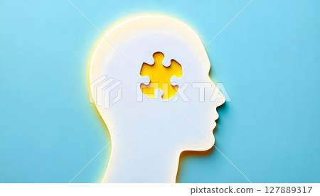 A white silhouette of a human head with an absent puzzle piece, representing the intricacies of mental health and the process of self-discovery A white silhouette of a human head with an absent puzzle piece, representing the intricacies of mental health and the process of self-discovery 127889317