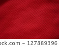 Close up of red football jersey sports clothing fabric texture. 127889396