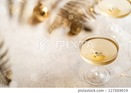 Two champagne glasses 127889659