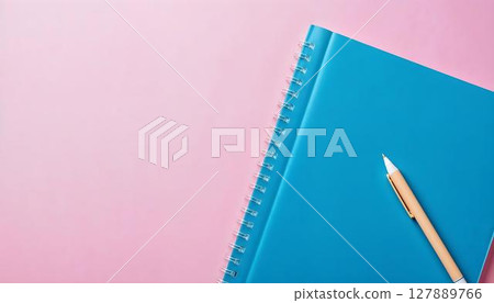 A vibrant display of school supplies set against a pink backdrop, featuring clear space for additional text 127889766