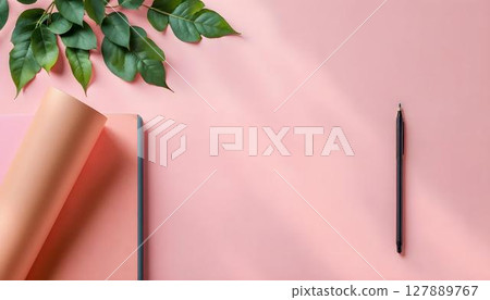 Colorful school supplies arranged on a pink background, providing ample copy space for text or branding 127889767
