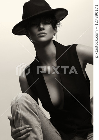 Monochrome portrait of Young Sexy Woman in hat Monochrome portrait of Young Sexy Woman in hat 127890171