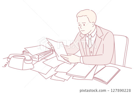 An office worker is reviewing important documents at their desk, ensuring accuracy 127890228