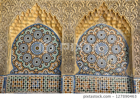 Ornamental and colorful arabesque carvings, mosaic tiles, zellige, medina of Tangier, Morocco Ornamental and colorful arabesque carvings, mosaic tiles, zellige, medina of Tangier, Morocco 127890463