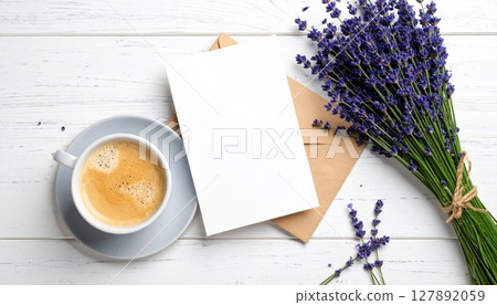 Coffee cup and pen on a blank notebook, ready for your business notes at the office desk or a relaxed cafe breakfast Coffee cup and pen on a blank notebook, ready for your business notes at the office desk or a relaxed cafe breakfast 127892059