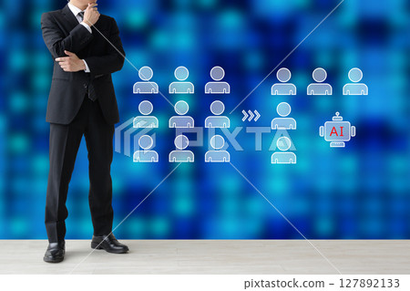 A businessman considering whether to reduce employees or introduce AI 127892133
