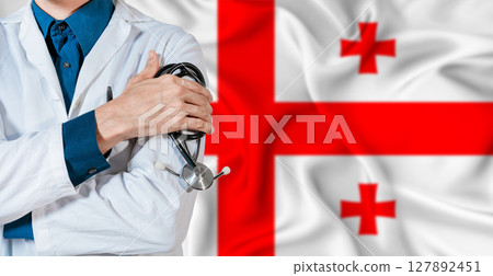 Doctor with stethoscope on Georgia flag. Doctor holding stethoscope on Georgia flag 127892451