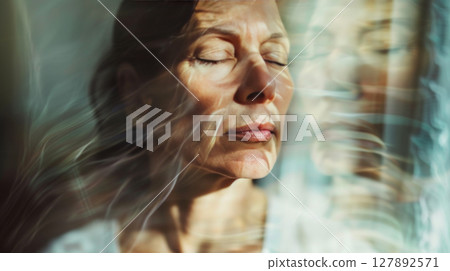 Serene Woman Reflecting with Eyes Closed 127892571