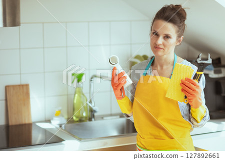 Woman with Plumbing Parts and Tools 127892661