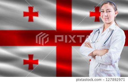 Female doctor on Georgia flag. Doctor with crossed arms on Georgia flag. Georgia health and care concept 127892971