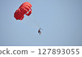 parasailing with red parachute 127893055