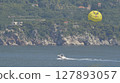 parasailing with yellow parachute 127893057