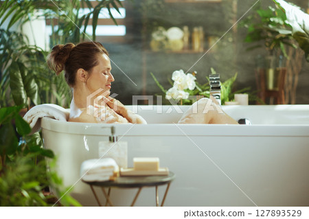Calm Moment: Woman in Lush Spa-like Bath 127893529