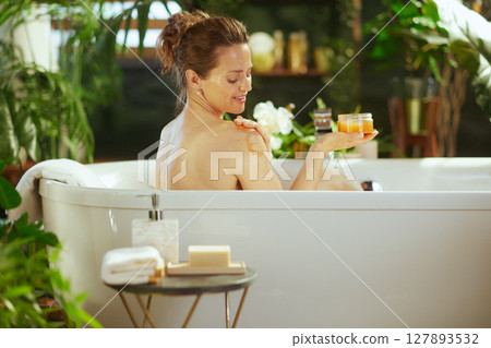 Smiling Woman\'s Spa-Like Skincare Ritual 127893532