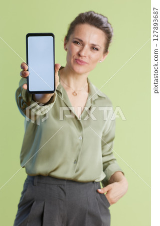 Woman Presenting Smartphone with Blank Screen Woman Presenting Smartphone with Blank Screen 127893687