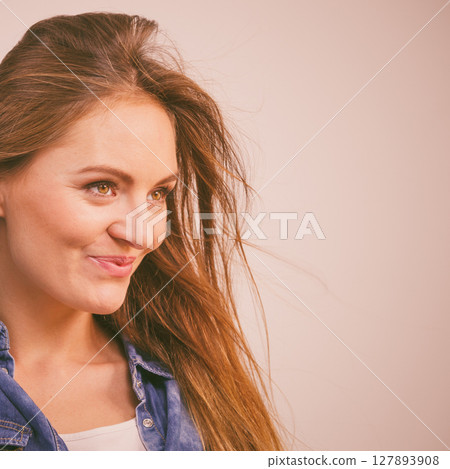 Joyful fashionable woman in denim shirt 127893908